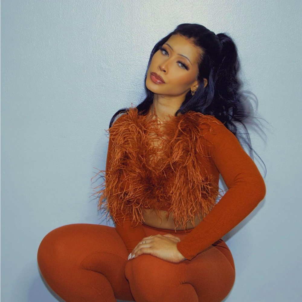 Burnt orange two piece with feathered top!